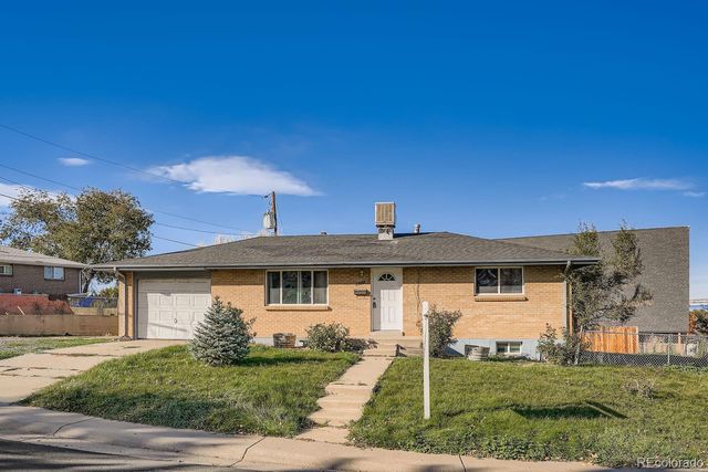 Ranch-style home in north Aurora with mature trees, typical of the 80011 housing stock we service